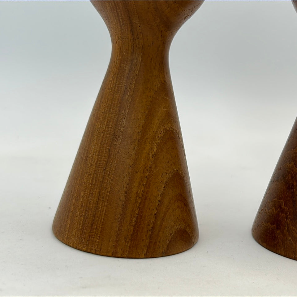 Two teak wood 60’s Danish design Candlesticks