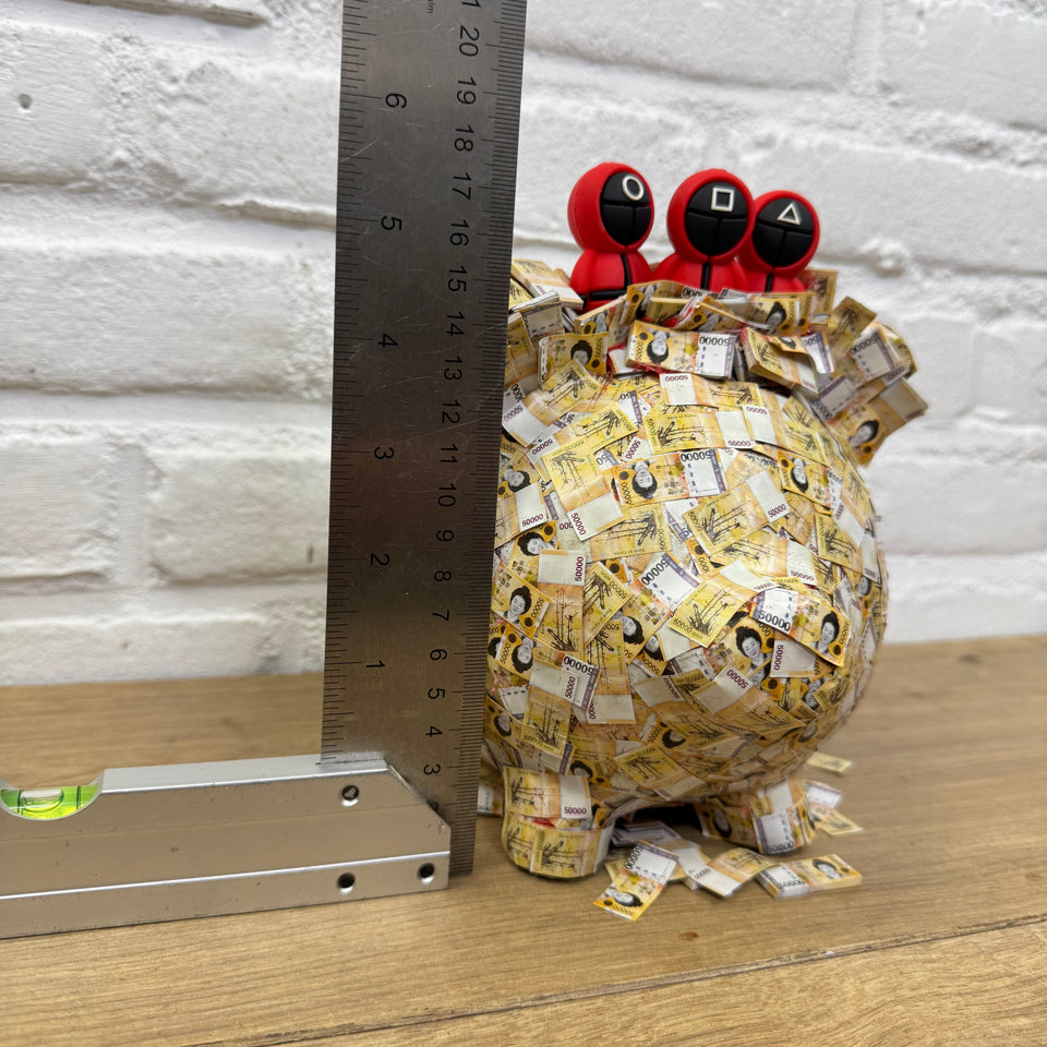The PiggyBank Squid Art Game characters on Piggy bank