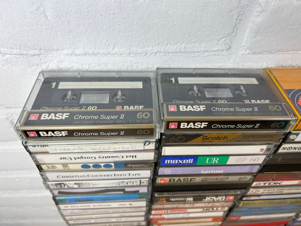 A bulk lot of 100 mixed cassette tapes (buy more with 10 percent more for free)