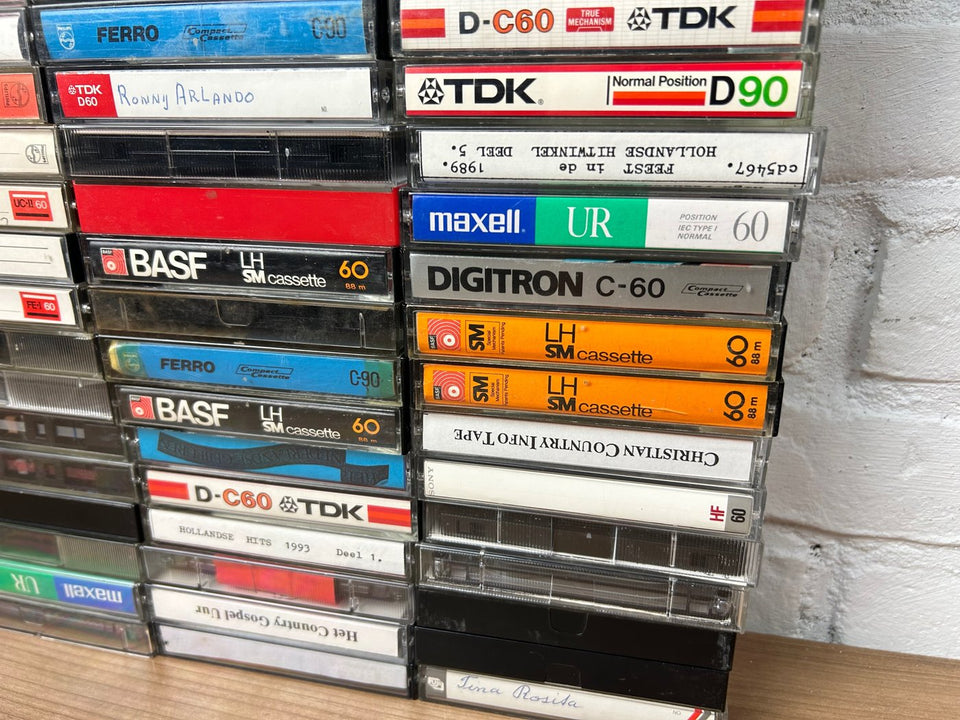 A bulk lot of 100 mixed cassette tapes (buy more with 10 percent more for free)