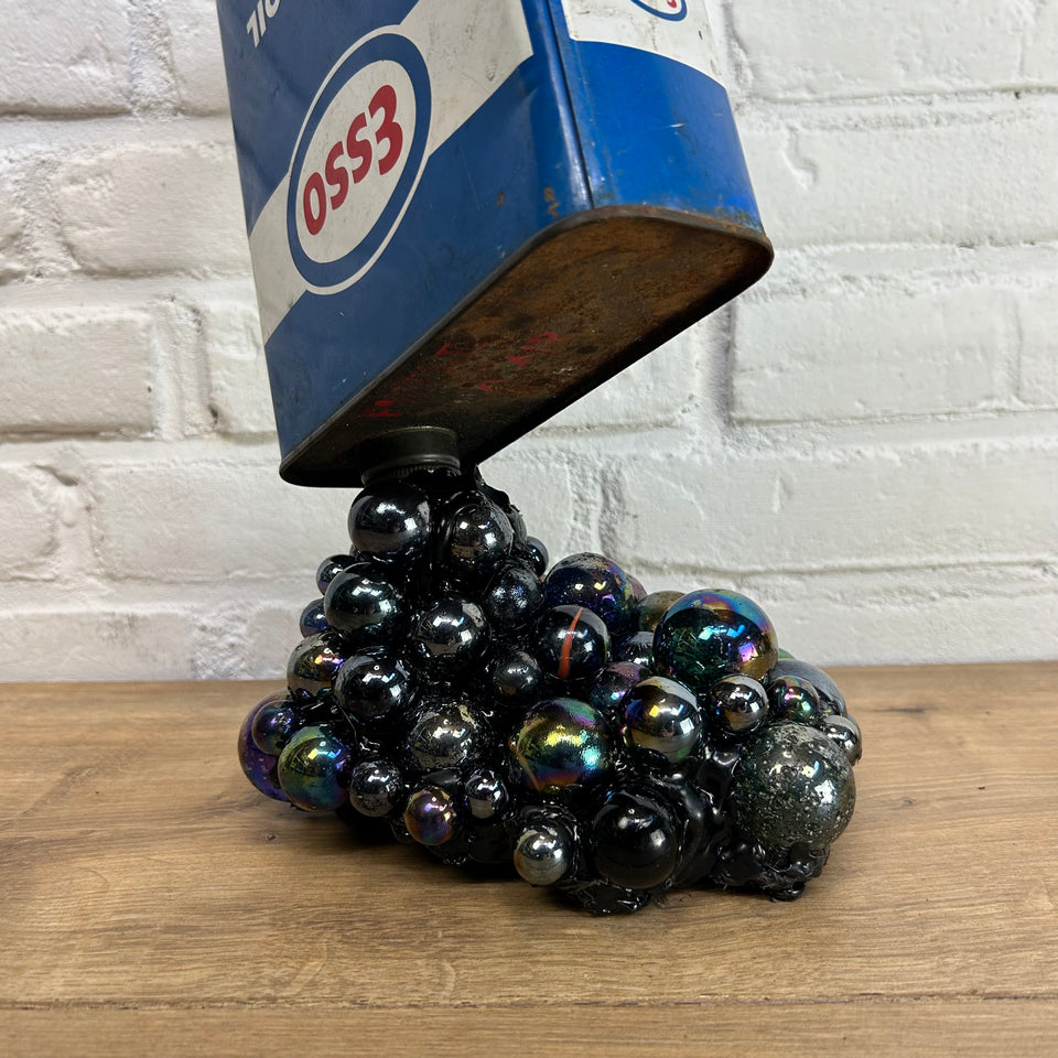 Esso oil can pouring Marbles statue