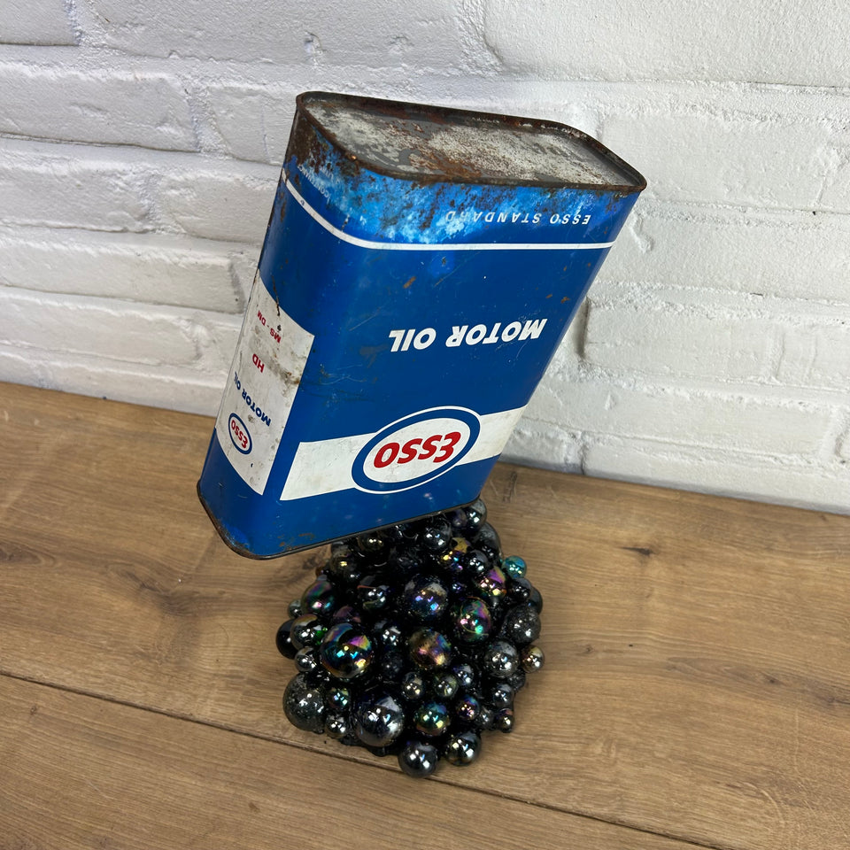 Esso oil can pouring Marbles statue