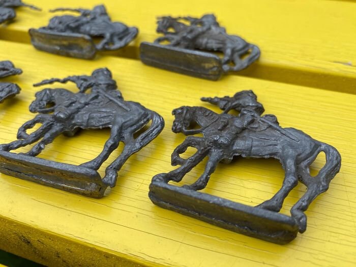16 Small tin soldiers on horses