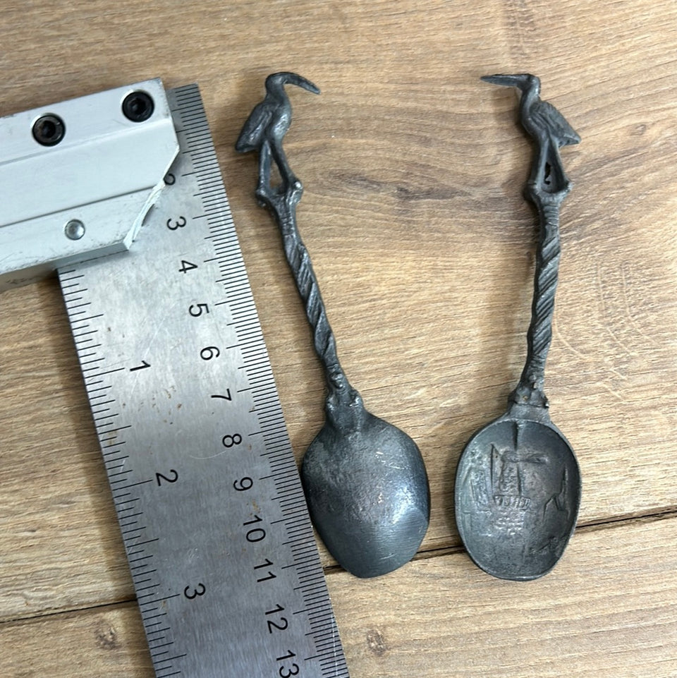 Antique wooden wall hanging with 6 old small Dutch tin spoons.