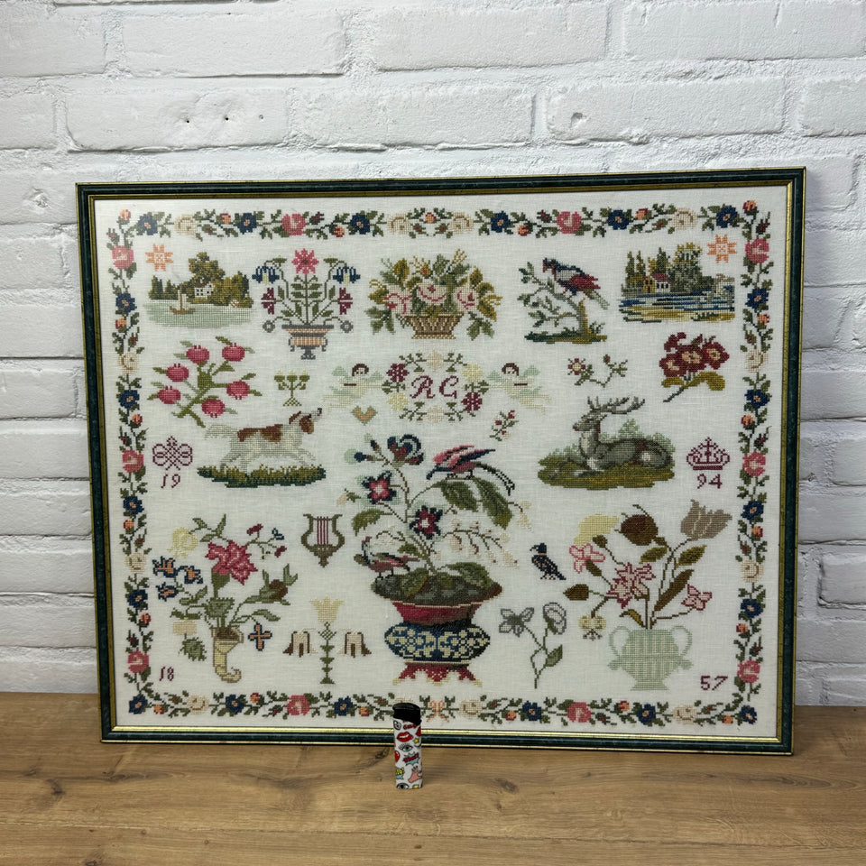 Large antique pattern Embroidery Sampler framed behind matt glass