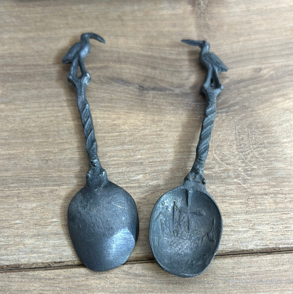 Antique wooden wall hanging with 6 old small Dutch tin spoons.