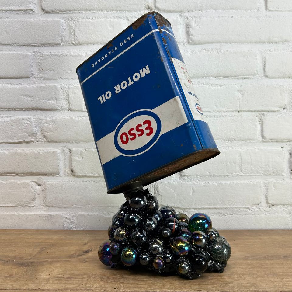 Esso oil can pouring Marbles statue