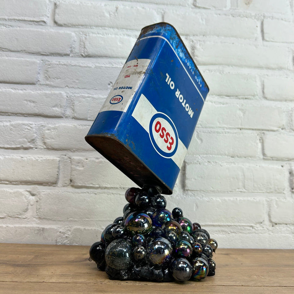 Esso oil can pouring Marbles statue