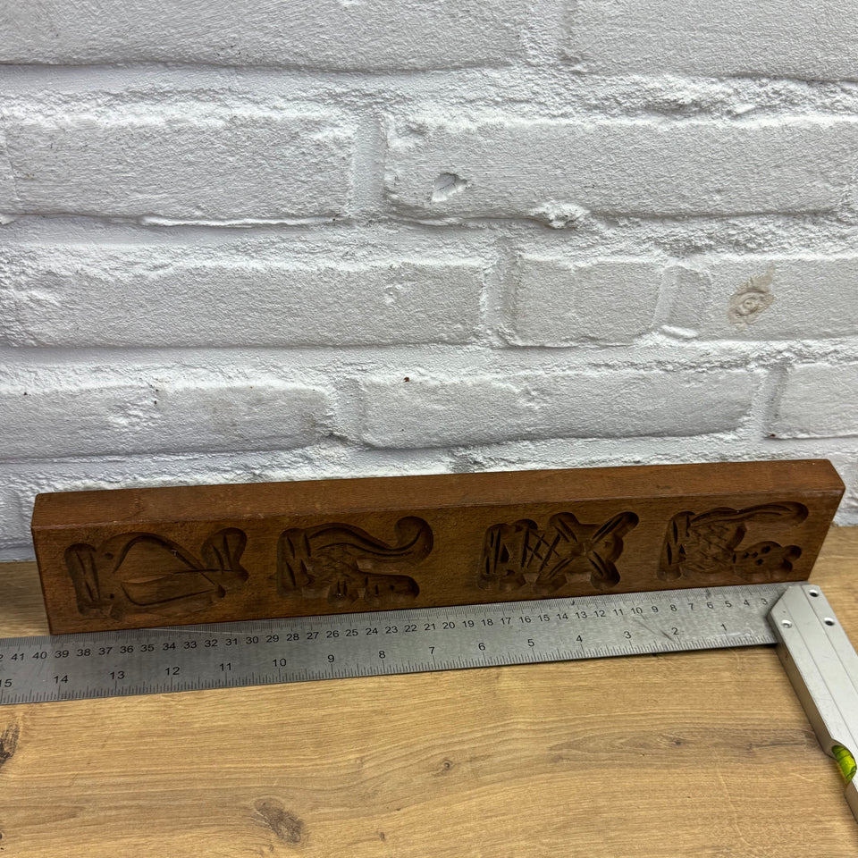 Antique set of five European wooden baking molds