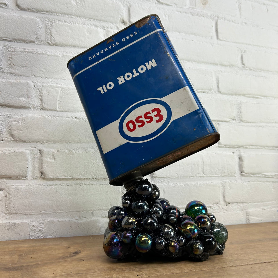 Esso oil can pouring Marbles statue