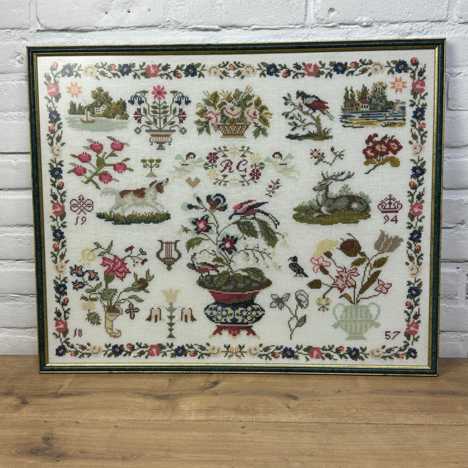 Large antique pattern Embroidery Sampler framed behind matt glass