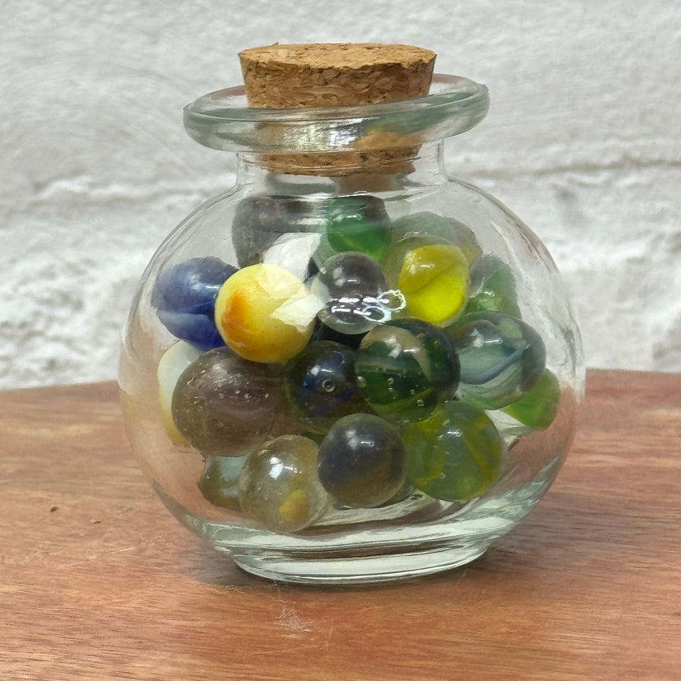 Miniature jar with randomly mixed antique and vintage peewee mini marbles