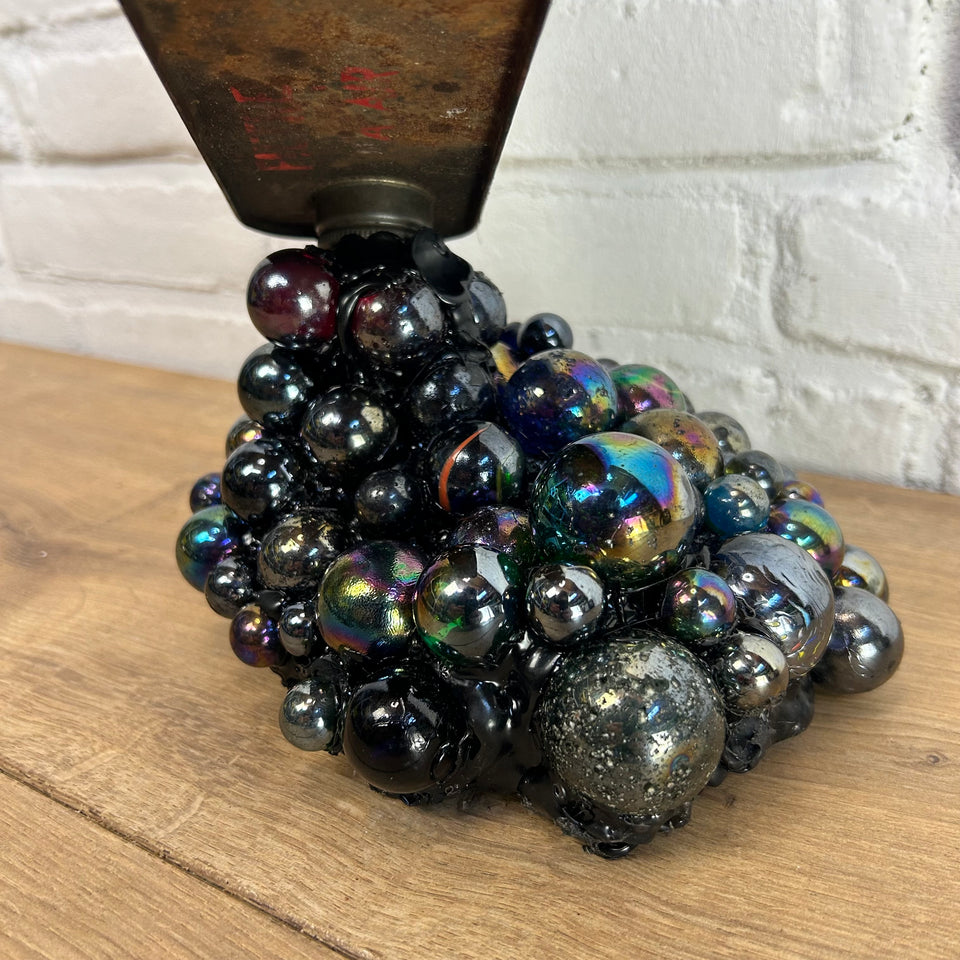 Esso oil can pouring Marbles statue