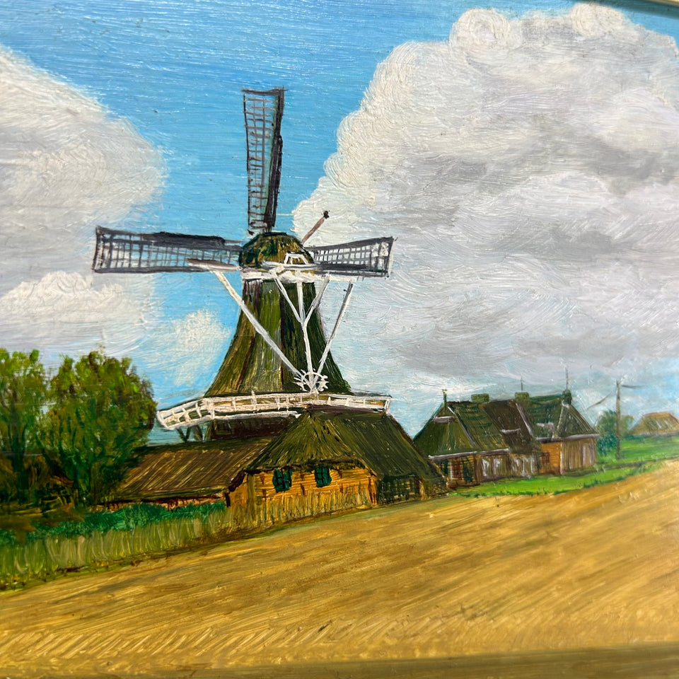 Dutch landscape Holwerd “Monnikmolen” with windmill and blue sky