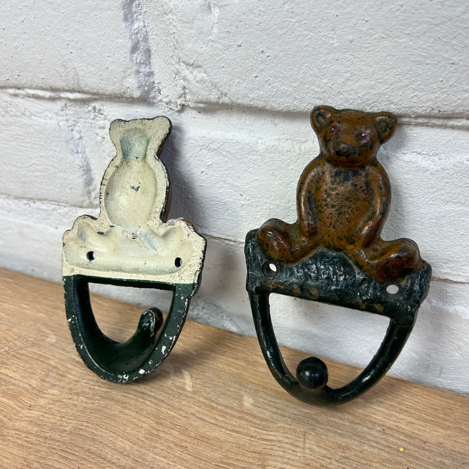 Antique cast-iron hangers with teddy bear for children’s room