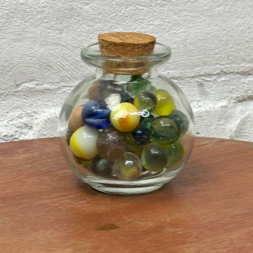 Miniature jar with randomly mixed antique and vintage peewee mini marbles