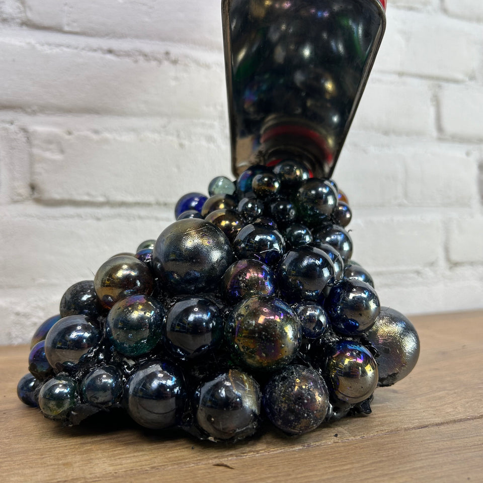 Shell oil can pouring Marbles statue