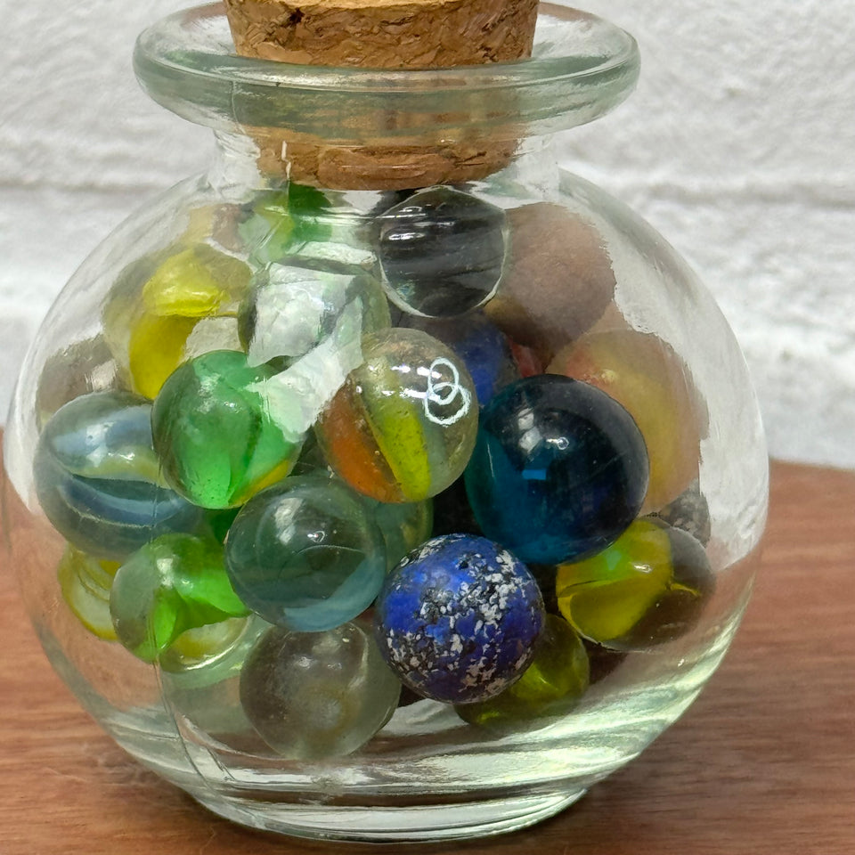 Miniature jar with randomly mixed antique and vintage peewee mini marbles