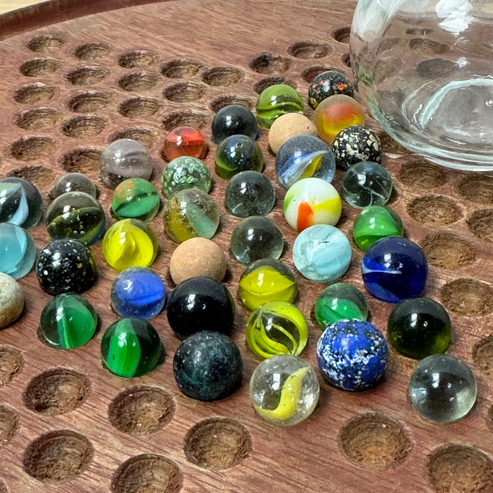 Miniature jar with randomly mixed antique and vintage peewee mini marbles