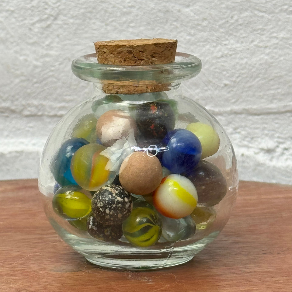 Miniature jar with randomly mixed antique and vintage peewee mini marbles