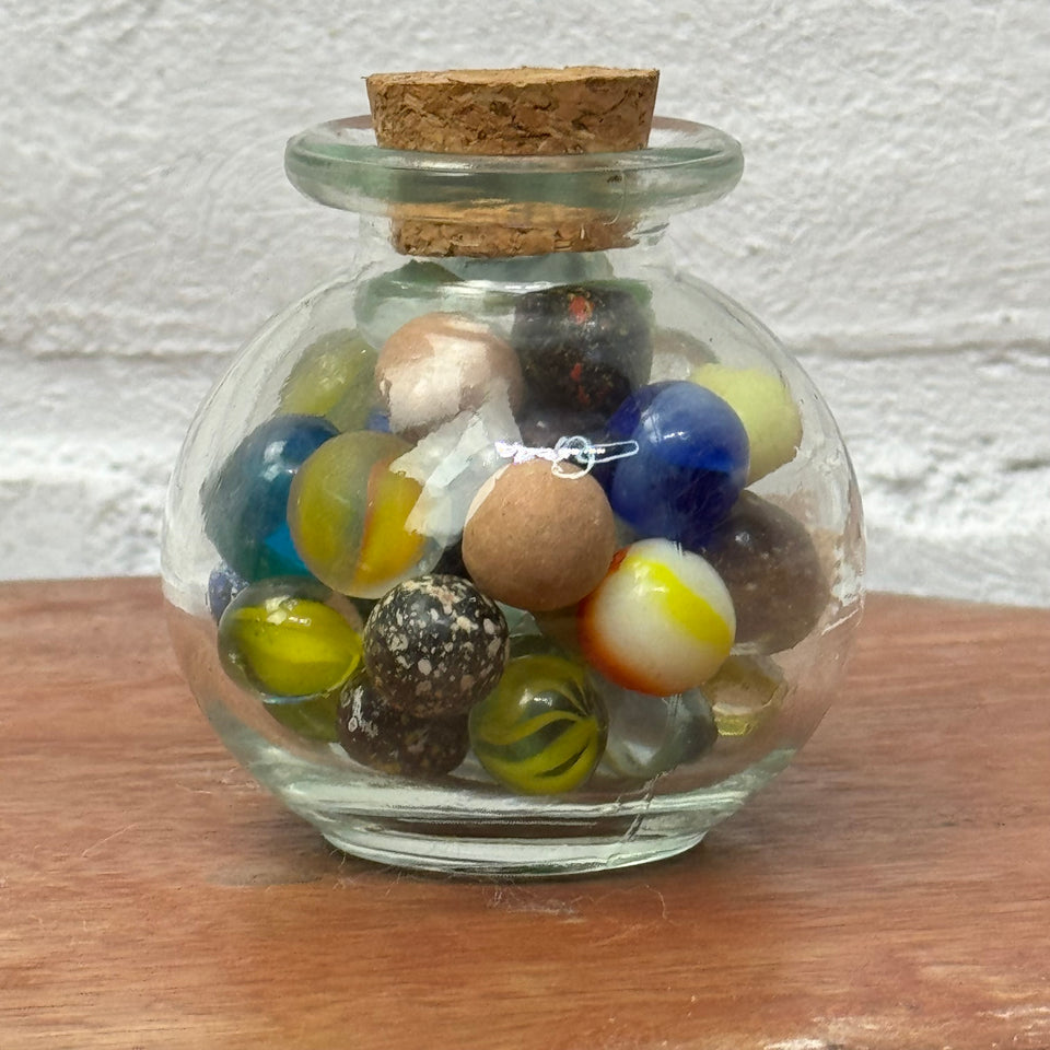 Miniature jar with randomly mixed antique and vintage peewee mini marbles