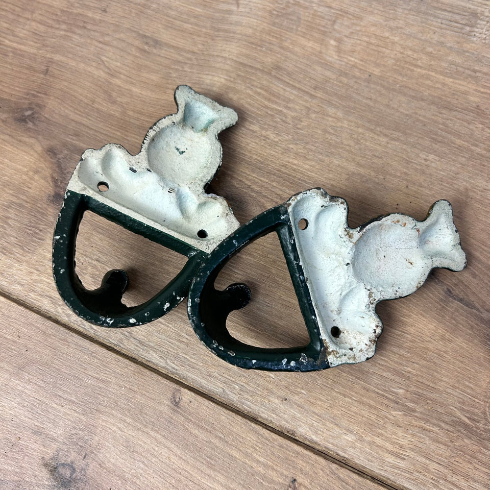 Antique cast-iron hangers with teddy bear for children’s room