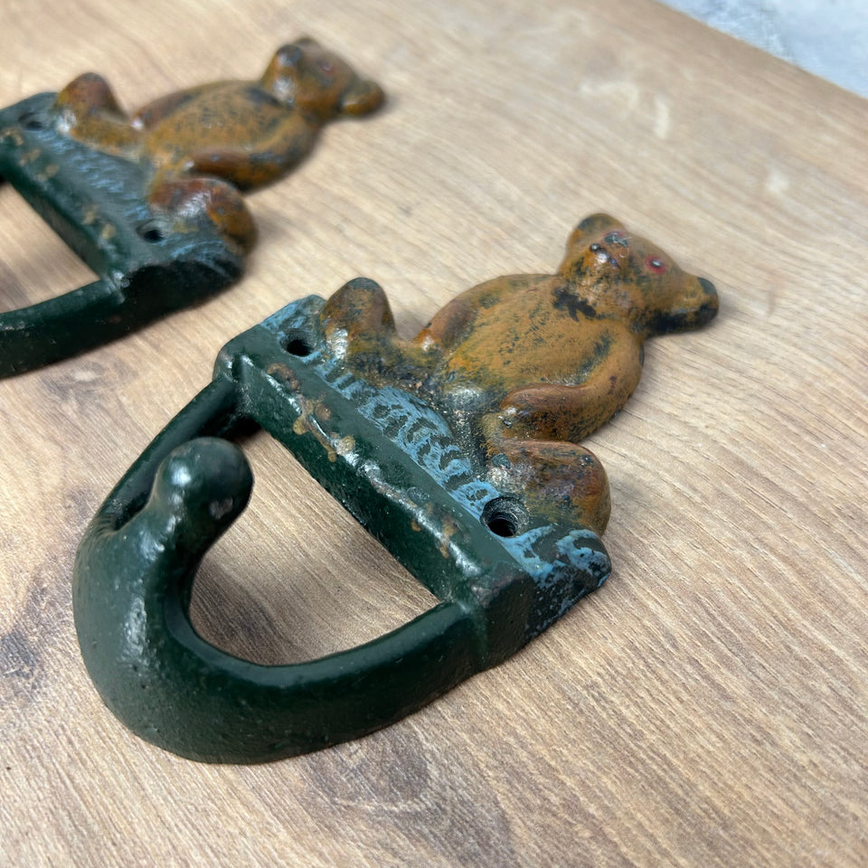 Antique cast-iron hangers with teddy bear for children’s room