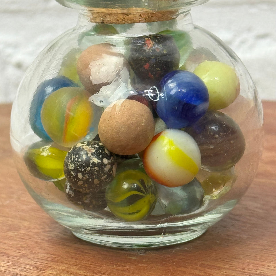 Miniature jar with randomly mixed antique and vintage peewee mini marbles