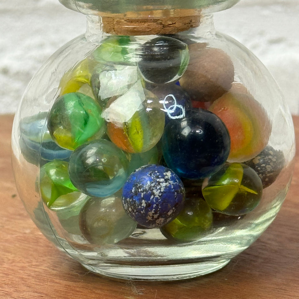 Miniature jar with randomly mixed antique and vintage peewee mini marbles