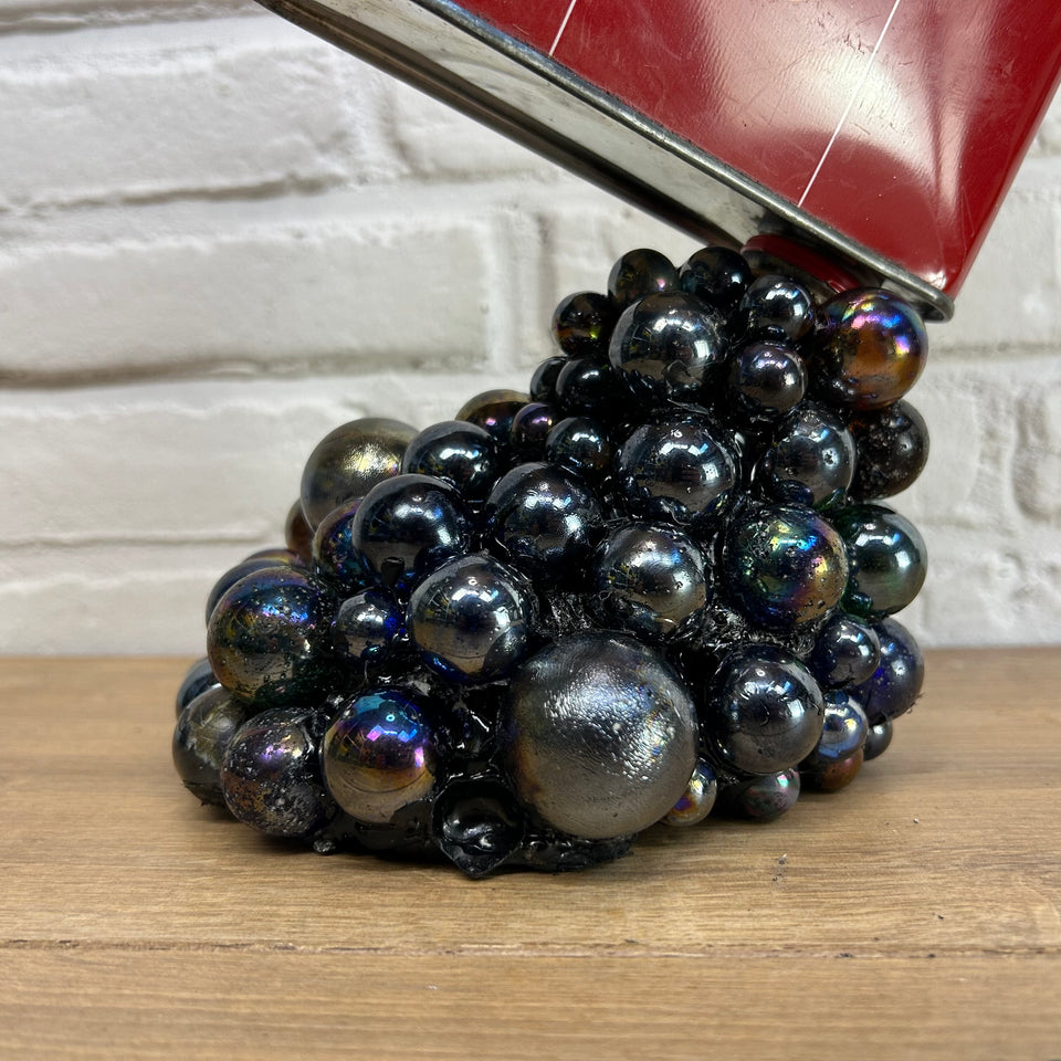 Shell oil can pouring Marbles statue