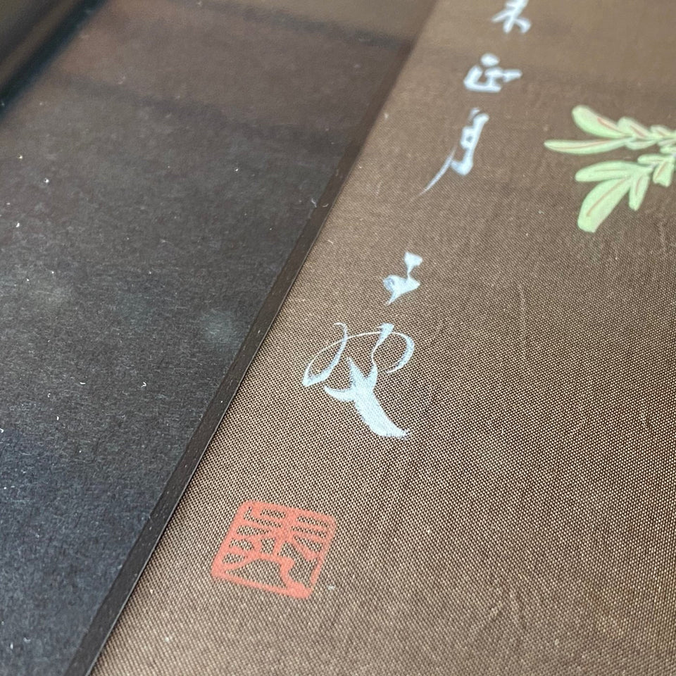 Two Chinese silk paintings flowers and birds - framed behind glass